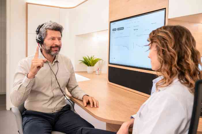 a woman looking at herself through a mirror