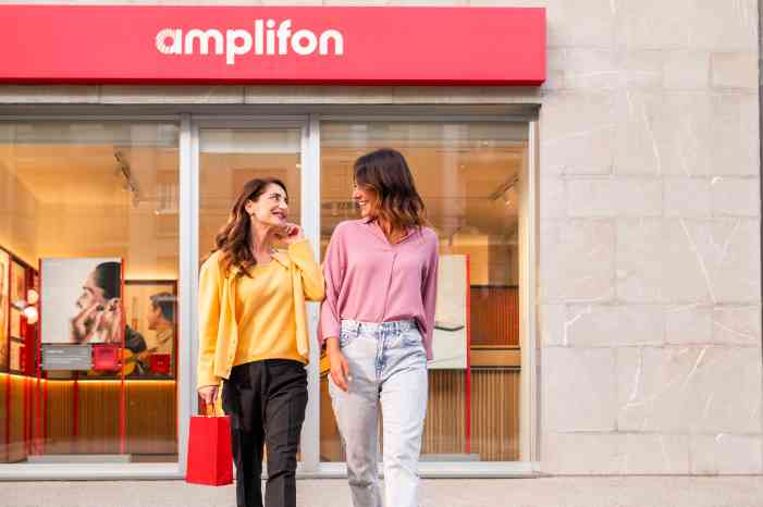 Two female clients exiting the Amplifon store