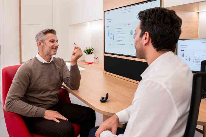 a woman looking at herself through a mirror