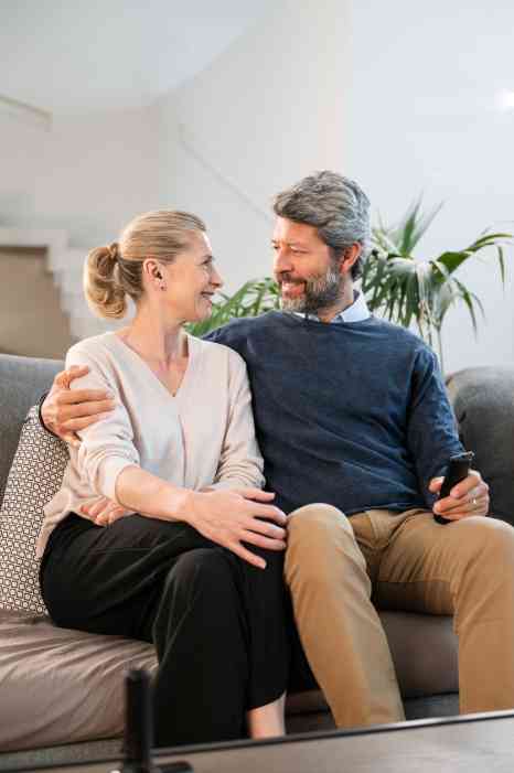 An audiologist shaking hands with a patient