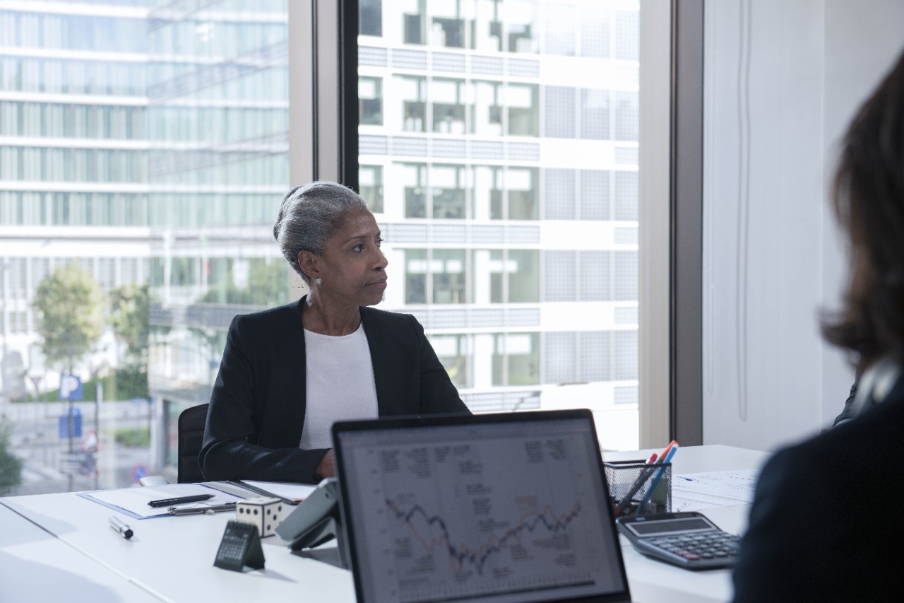 A business woman with hearing devices