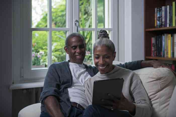 A couple looking at a tablet