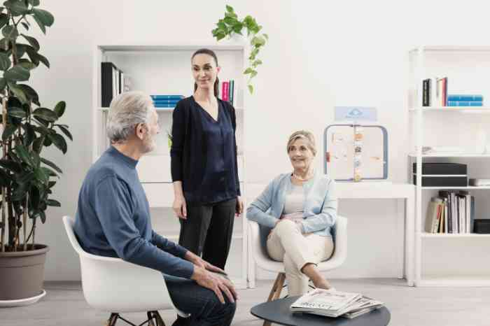 Three people talking in a Bay Audiology store