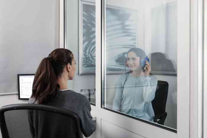 A woman taking a hearing test
