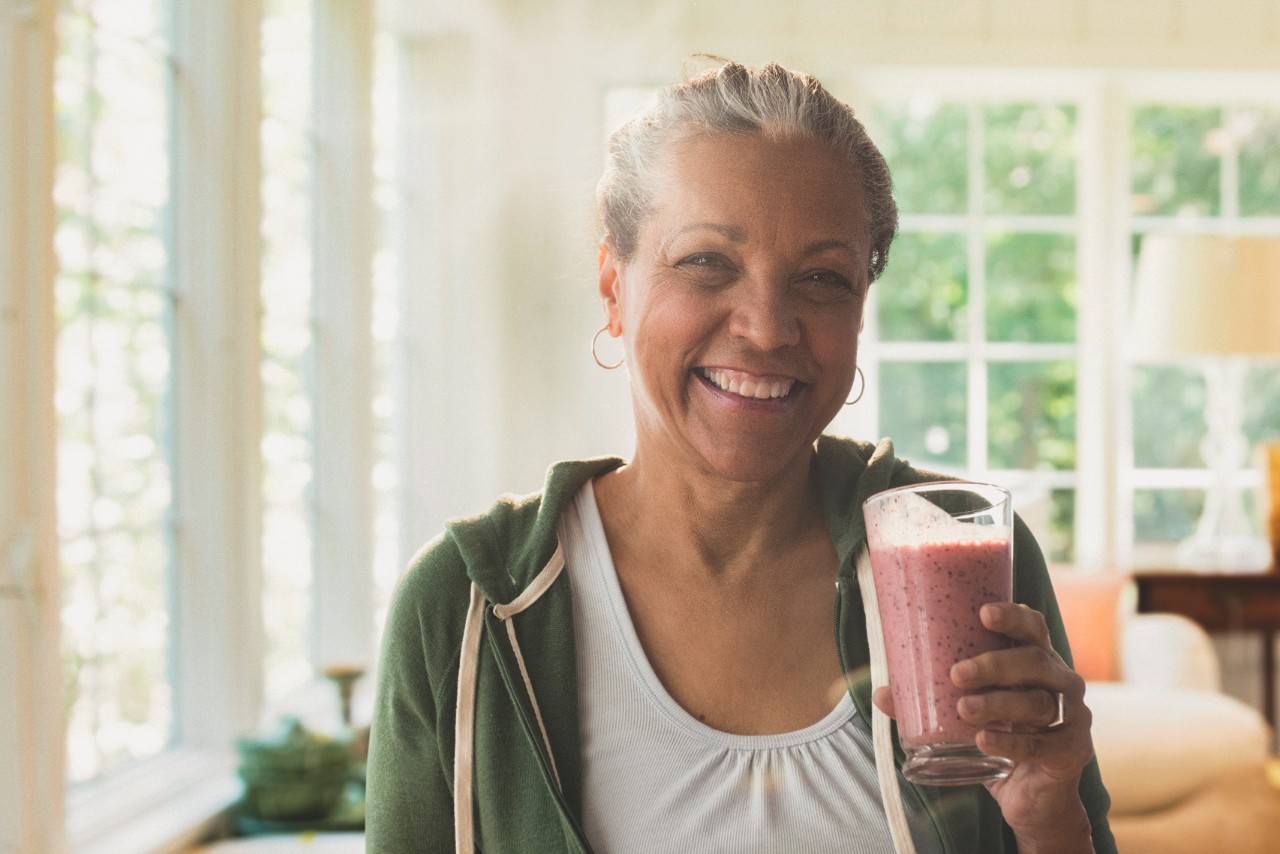 woman drinking smoothie