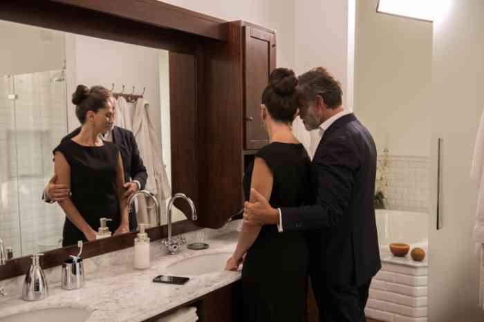 a senior couple getting ready in their bathroom