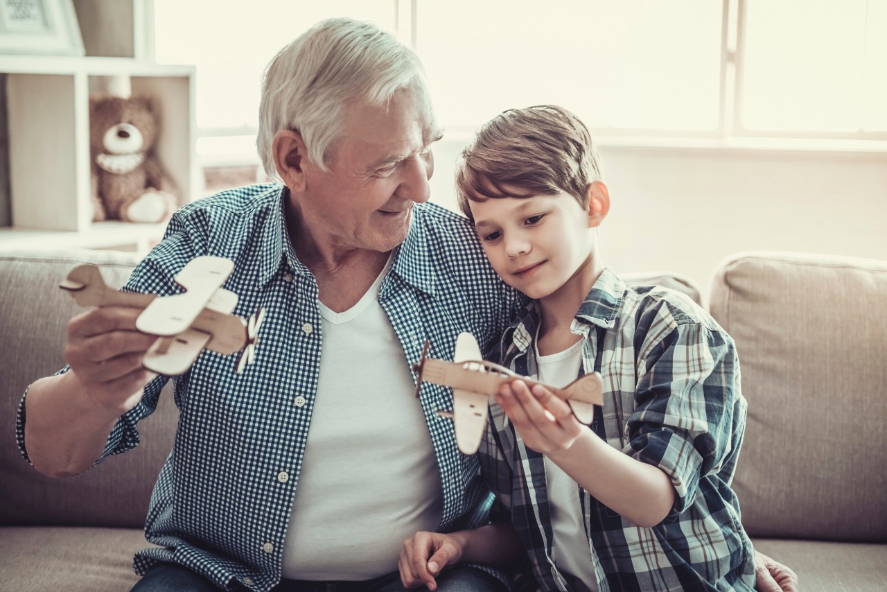 old man and child playing