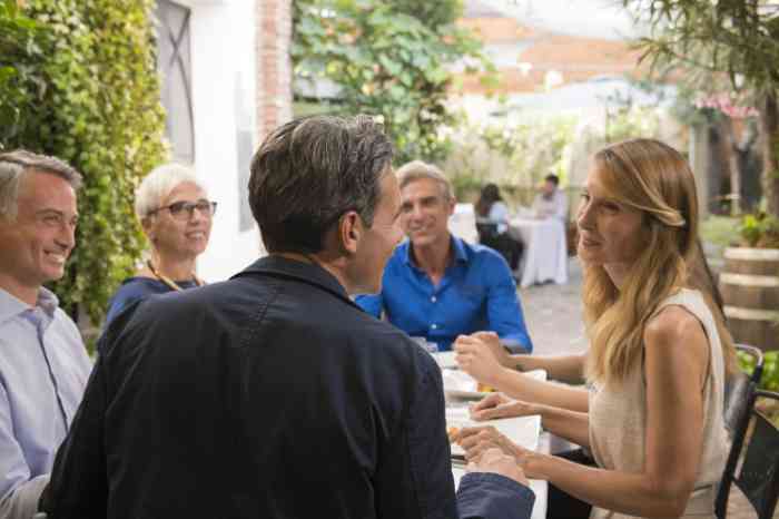 People sitting around a table talking to each other