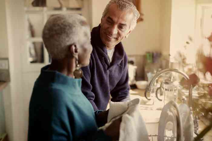 A couple with Amplifon hearing aids at home