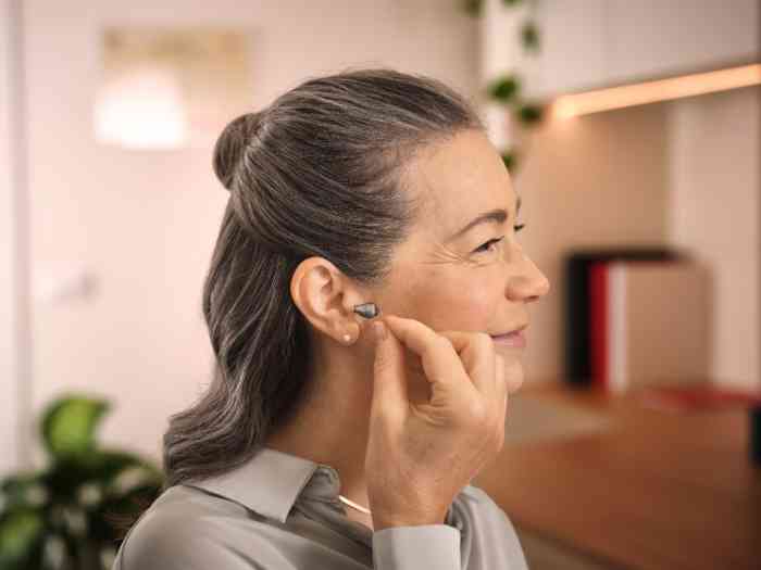 a woman wearing the hearing aid