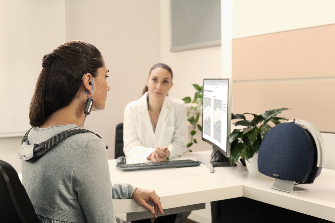 A woman during a hearing test with her NHC audiologist