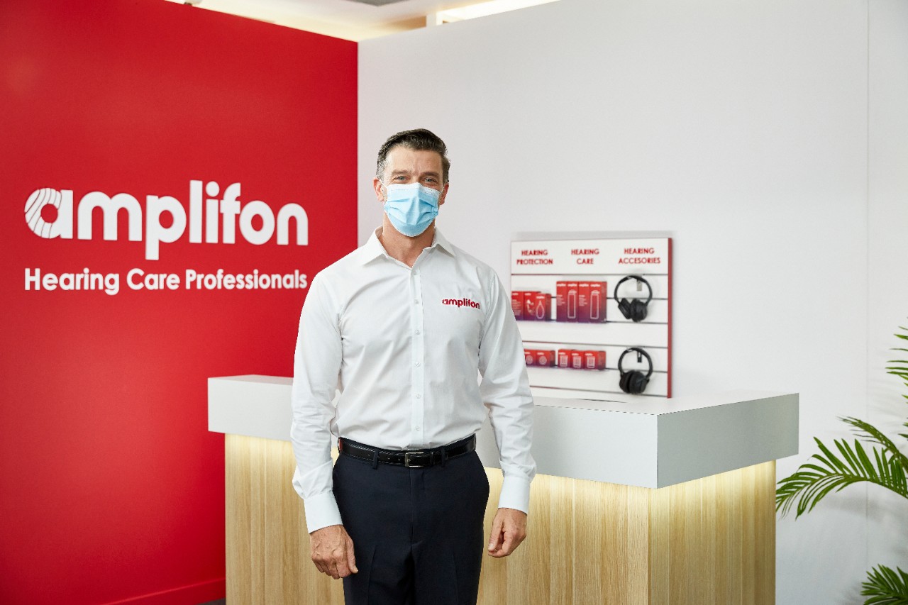 an audiologist wearing a mask