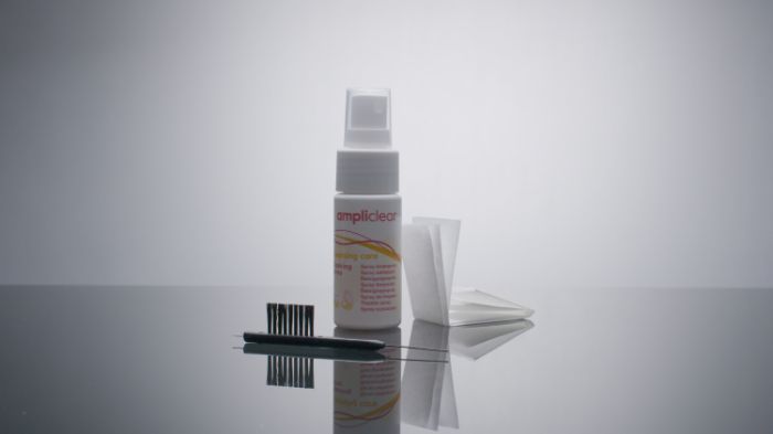 a kit for hearing aids cleaning with hearing aid cleaning wipes, spray and tube cleaners