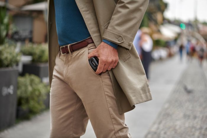 Person taking a device out of the pocket