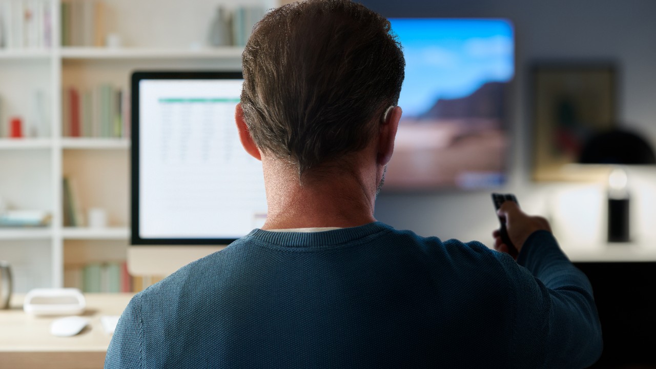 a man watching the tv