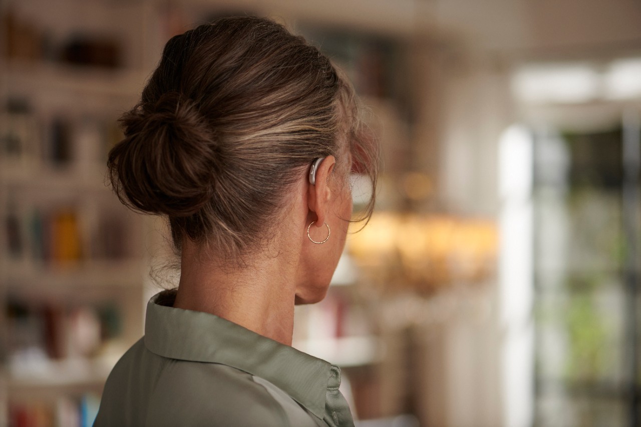 a woman wearing the hearing aid